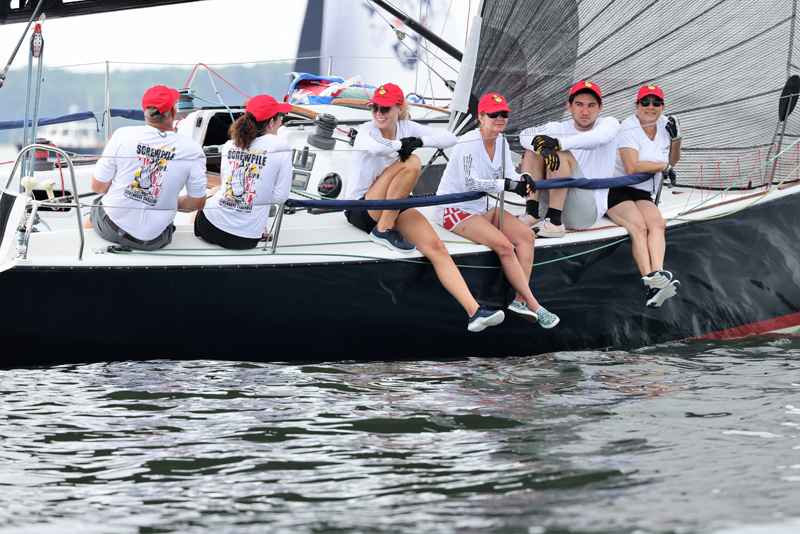racing sailors in red hats
